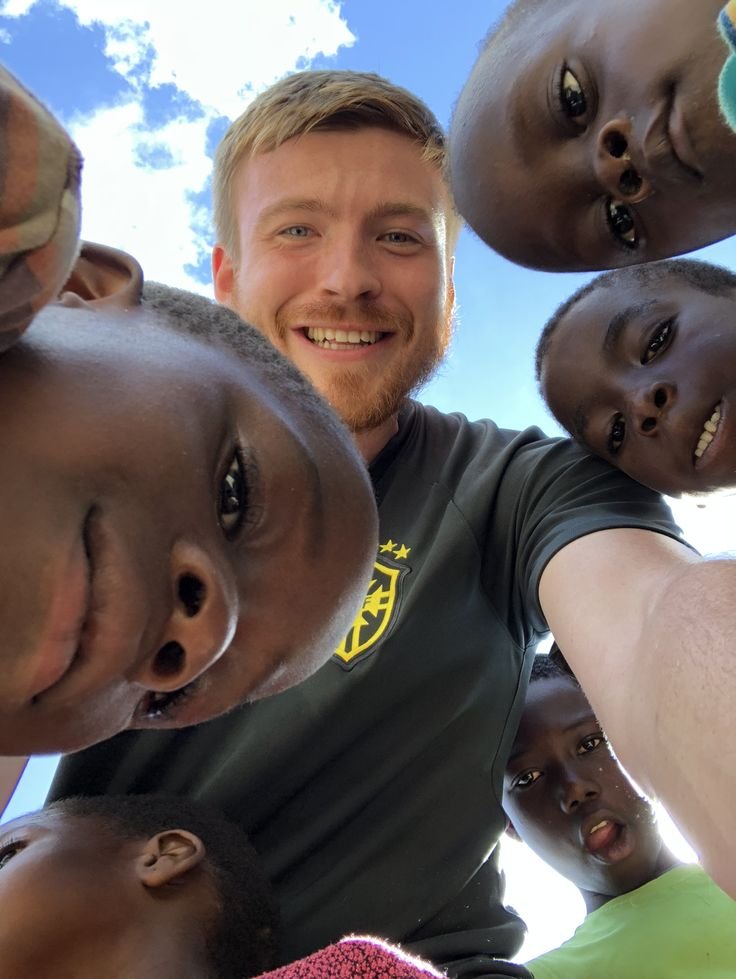 robbie with the children at the orphanage 2
